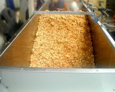 Storeveyor handling various crisps.
