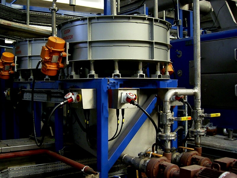 Vibrating screen installed in processing facility.
