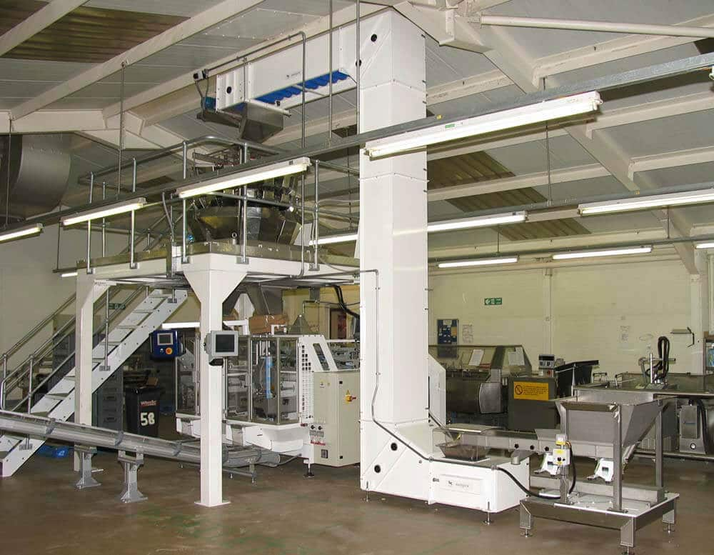 Bucket elevator feeding a multihead weigher.