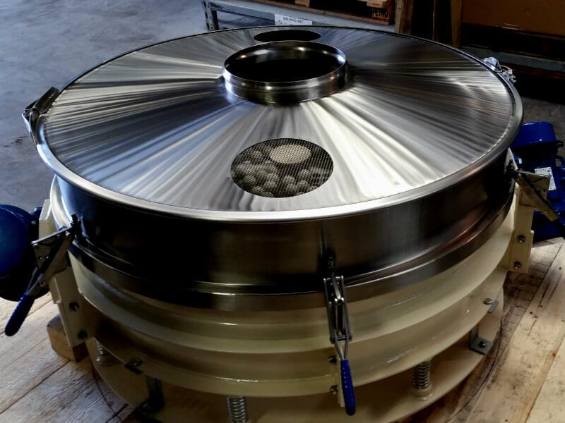 Vibrating screen with top cover and ball tray.